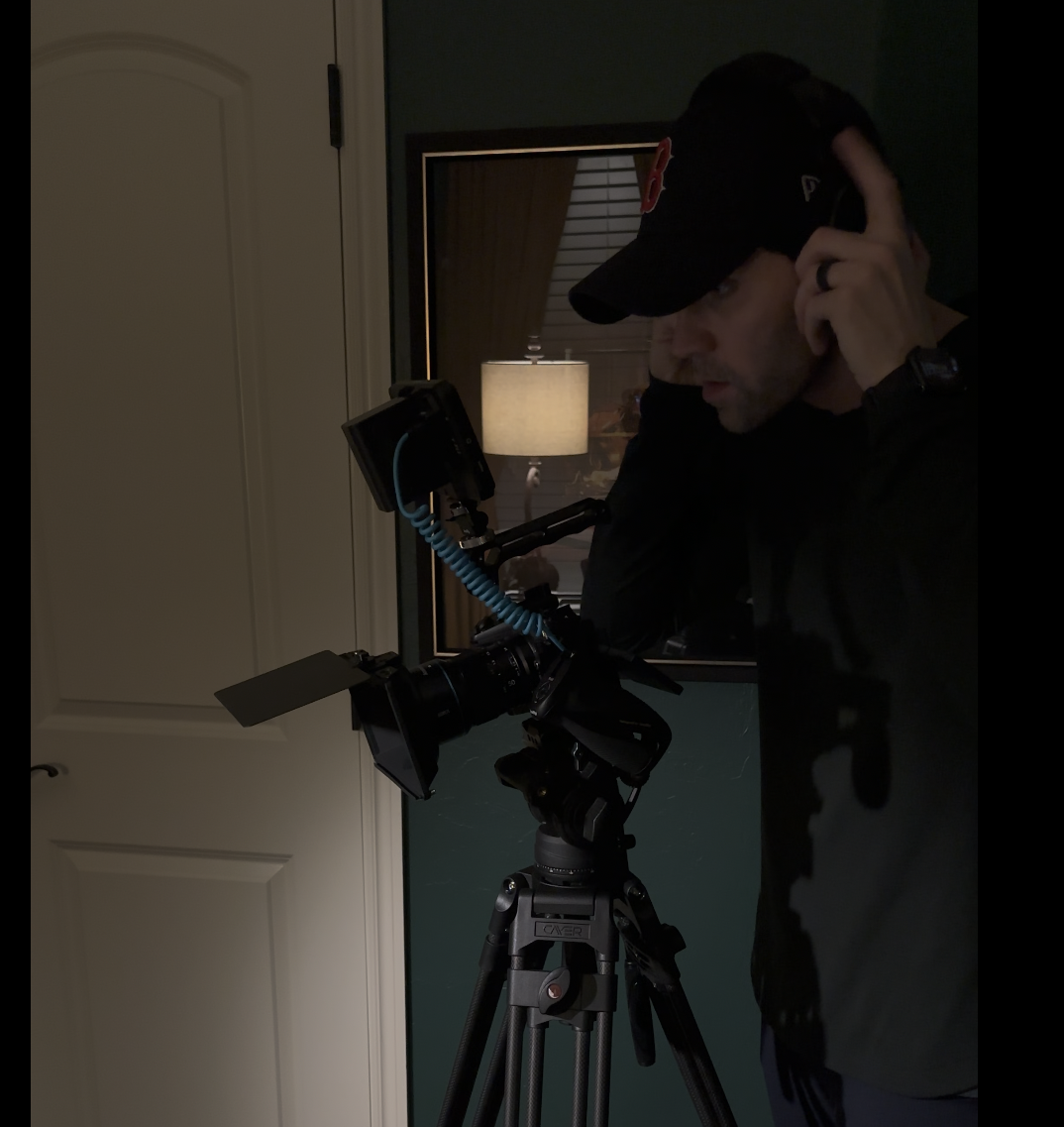 Ryan Coleman operating cinema camera on set